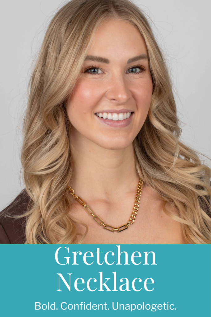 A blonde woman wearing the Gretchen Necklace in gold stainless— a bold, chunky chain with mixed textures. The necklace rests at the collarbone, adding a modern, edgy touch to her outfit.
Close-up of the Gretchen Necklace in stainless steel, styled with soft curls and a neutral top, showcasing the necklace’s chunky links and polished finish.